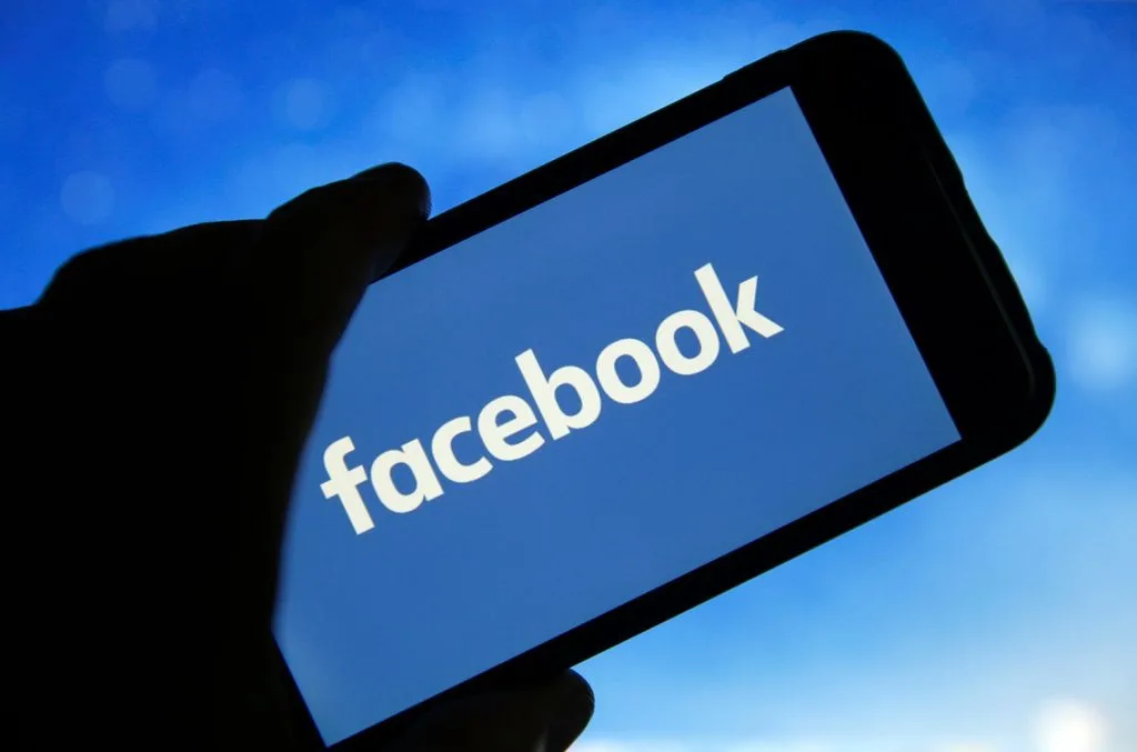 A smartphone showing the Facebook logo, representing the platform’s role in social media marketing. Facebook group suspensions like these are shaping content strategies in Gold Coast.
