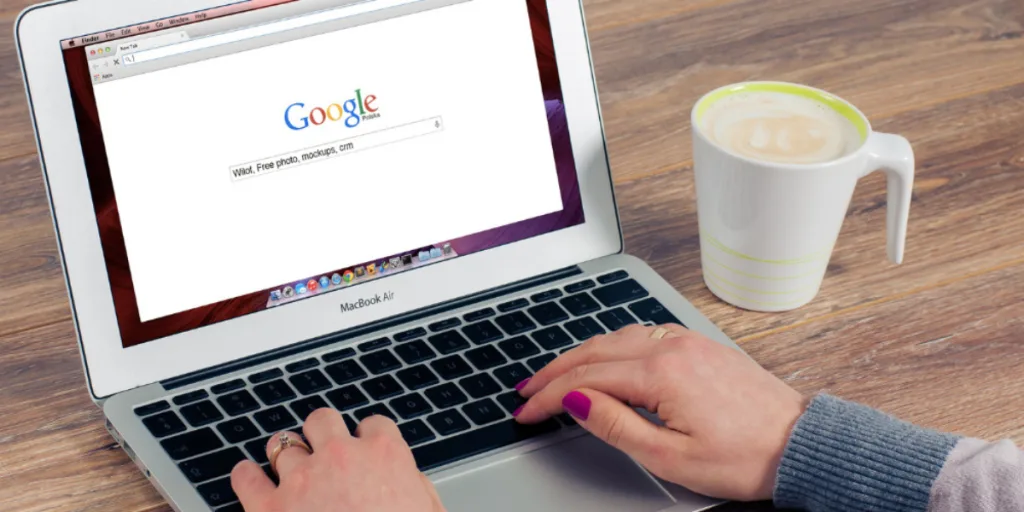 Person using a laptop to search on Google, illustrating risks of SEO poisoning and the need for SEO service Gold Coast with preventative measures.