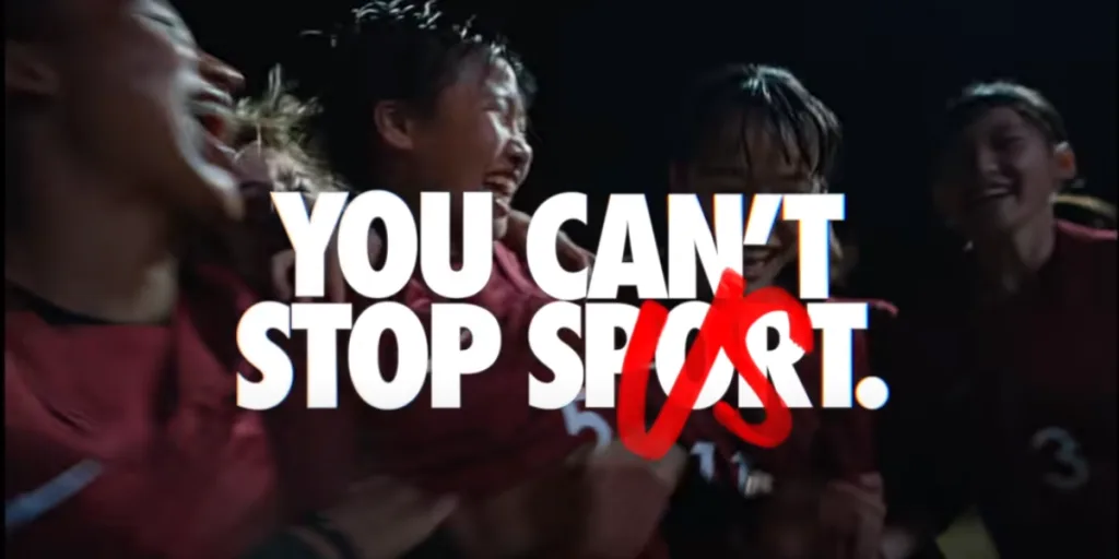 Nike campaign featuring a group of athletes celebrating together with bold text overlay saying ‘You can’t stop sport / us’.