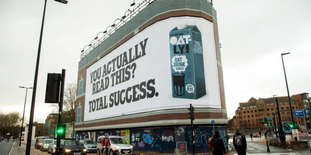 Large outdoor anti-marketing ad by Oatly with ironic copy, an example of disruptive creativity influencing digital marketing Gold Coast campaigns.