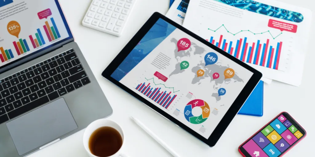 Charts and graphs displayed on a laptop and tablet showing UX research data and analytics — Make Your UX Research Hard To Ignore, web design Gold Coast.
